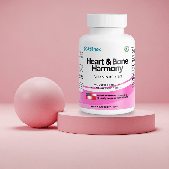 Supplement bottle labeled 'Heart & Bone Harmony' by Atlinex on a pink background