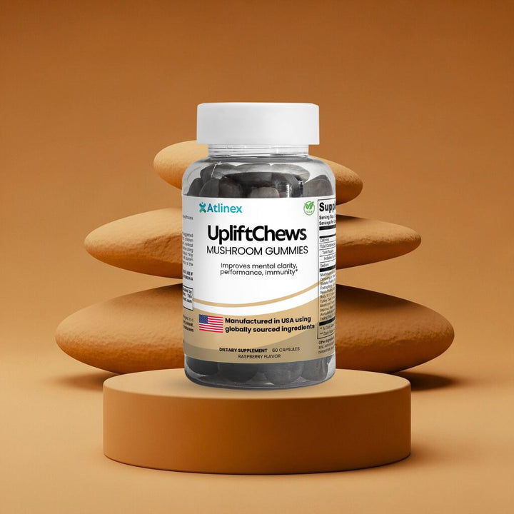 Bottle of Atlinex UpliftChews mushroom gummies on a brown platform with stones in the background